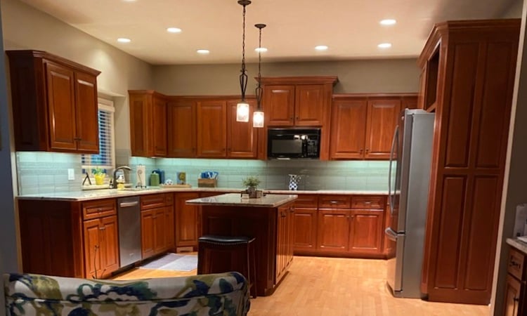 Kitchen with stained oak cabinets.