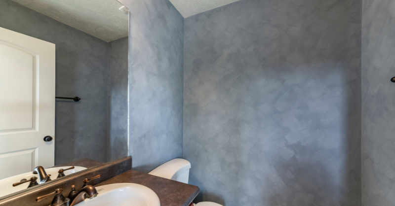 Bathroom walls with dark gray faux painting.