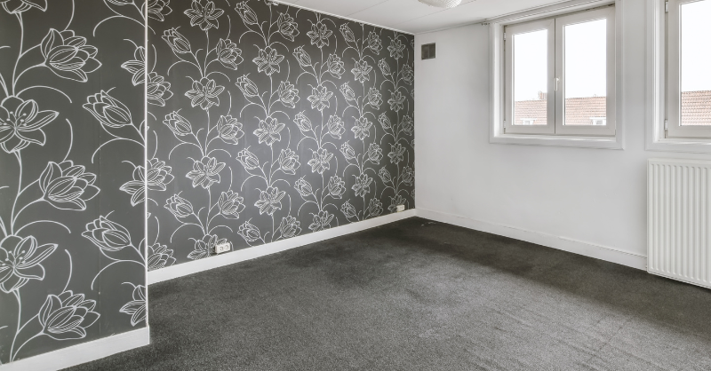 Clean wallpaper with white flower prints on an accent wall.